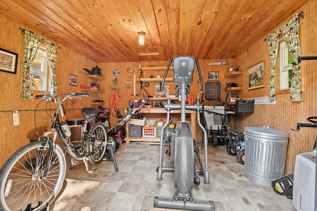 exercise area with wooden walls and wood ceiling