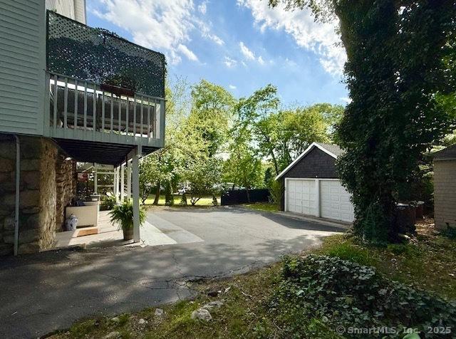 exterior space featuring an outdoor structure and a garage
