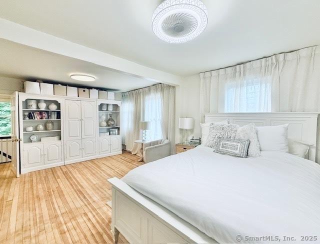 bedroom with light wood finished floors