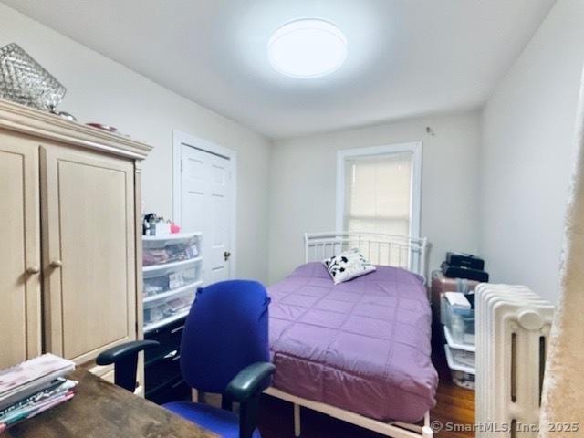 bedroom featuring radiator heating unit