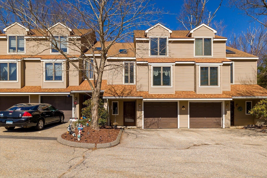 13 Westside Dr # 93, Thompson, CT 06255 - view of property with a garage and driveway