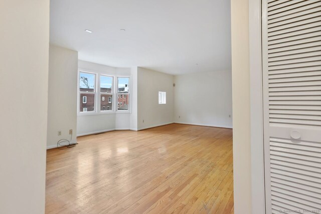 95 Audubon St Unit 222Aka 24, New Haven, CT 06510 - empty room with light wood finished floors, baseboards, and plenty of natural light