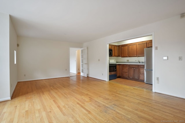 95 Audubon St Unit 222Aka 24, New Haven, CT 06510 - unfurnished living room featuring light wood-type flooring and baseboards