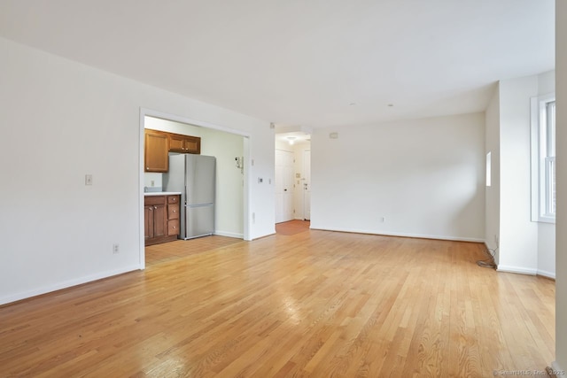 95 Audubon St Unit 222Aka 24, New Haven, CT 06510 - unfurnished living room with light wood-style flooring and baseboards