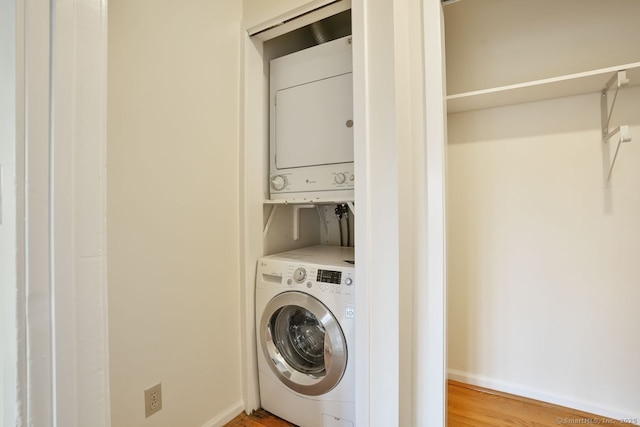 95 Audubon St Unit 222Aka 24, New Haven, CT 06510 - laundry room with light wood-style flooring, laundry area, stacked washer and clothes dryer, and baseboards