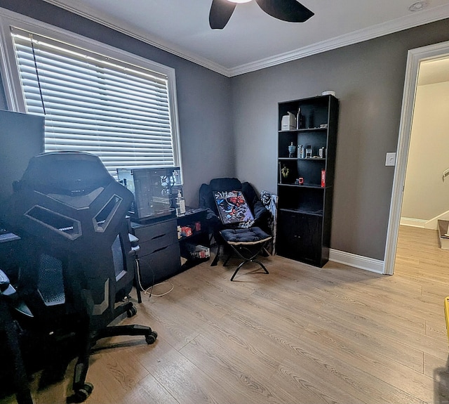 office area featuring a ceiling fan, wood finished floors, baseboards, and ornamental molding
