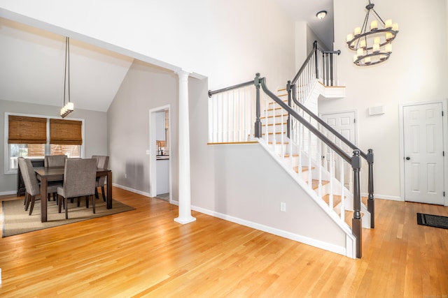 5A Big Buck Ln, Brookfield, CT 06804 - dining room with baseboards, high vaulted ceiling, a chandelier, and wood finished floors