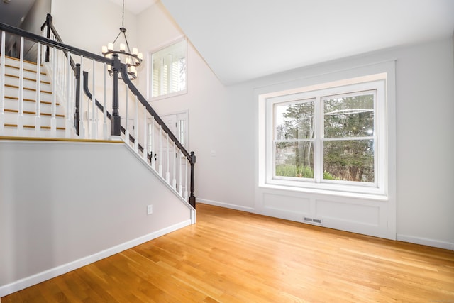 5A Big Buck Ln, Brookfield, CT 06804 - interior space with a notable chandelier, baseboards, stairs, visible vents, and wood finished floors