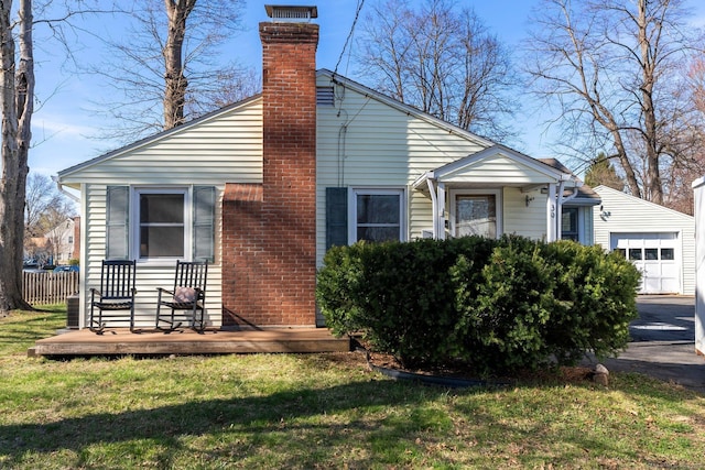 view of front of house featuring a front yard, a deck, and a chimney