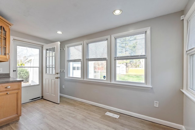entryway with light wood-style flooring, baseboards, visible vents, and recessed lighting