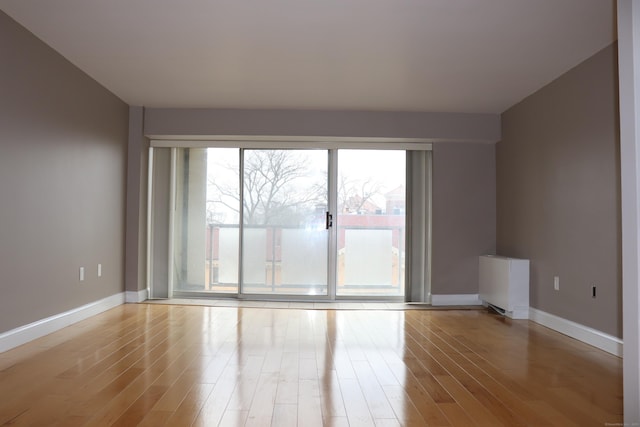 30 Woodland St Unit 5B, Hartford, CT 06105 - empty room with light wood-style floors and baseboards
