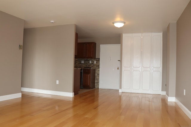 30 Woodland St Unit 5B, Hartford, CT 06105 - unfurnished living room featuring light wood-style flooring and baseboards
