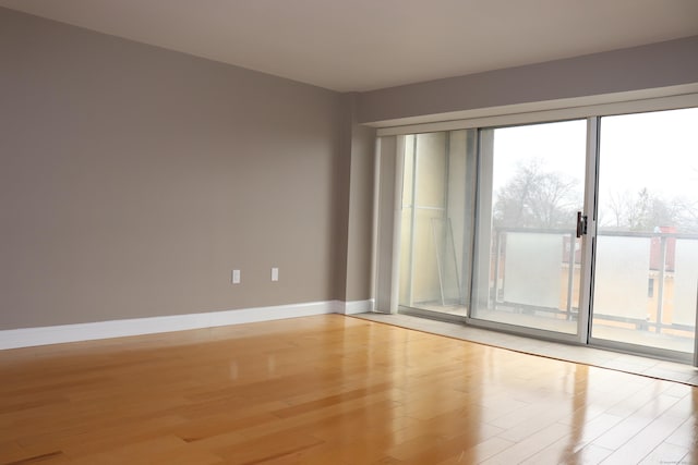 30 Woodland St Unit 5B, Hartford, CT 06105 - empty room with baseboards and light wood-type flooring