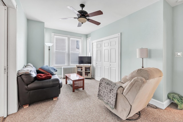 172 Prospect Ave, Shelton, CT 06484 - living area with radiator, light colored carpet, ceiling fan, and baseboards