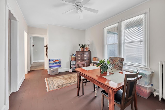172 Prospect Ave, Shelton, CT 06484 - dining space with radiator, ceiling fan, baseboards, and dark wood-style flooring