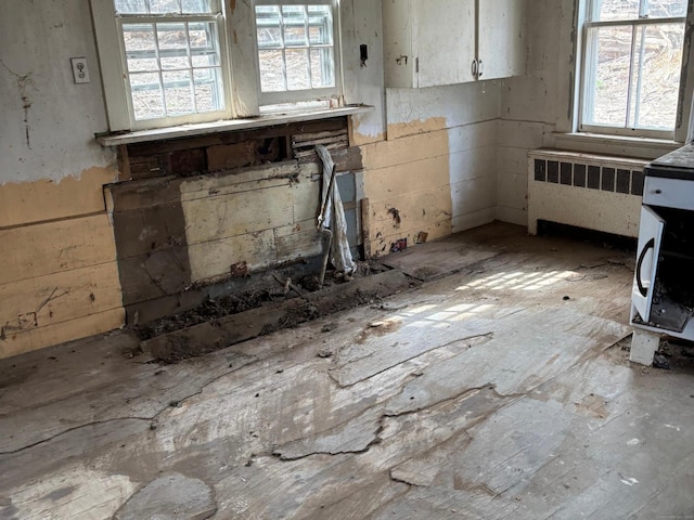 9 Winding Rd, Brookfield, CT 06804 - interior space with radiator heating unit and white cabinets