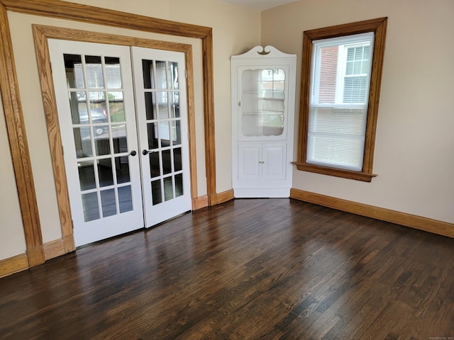 doorway to outside featuring dark wood-style flooring, french doors, and baseboards