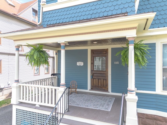 doorway to property featuring covered porch