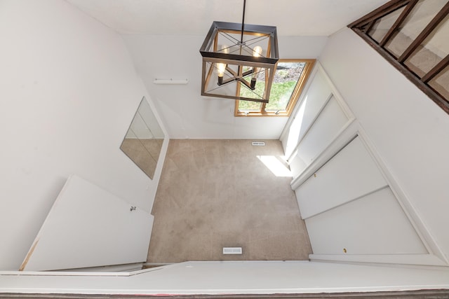 170 Barker Hill Dr, Guilford, CT 06437 - staircase with a chandelier and vaulted ceiling
