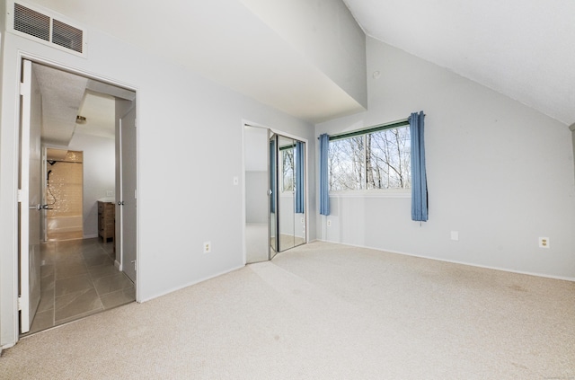 170 Barker Hill Dr, Guilford, CT 06437 - unfurnished bedroom featuring carpet floors, vaulted ceiling, a closet, and ensuite bath