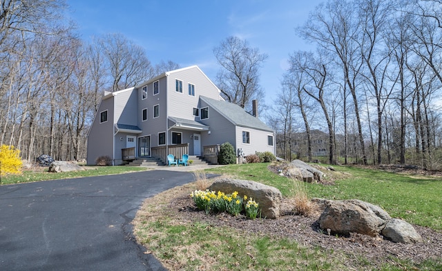 170 Barker Hill Dr, Guilford, CT 06437 - view of front of house featuring a chimney and a front lawn