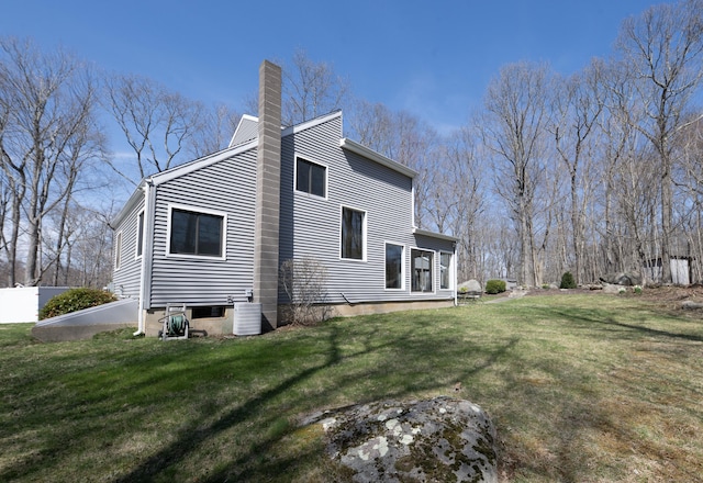 170 Barker Hill Dr, Guilford, CT 06437 - view of home's exterior with a chimney and a yard