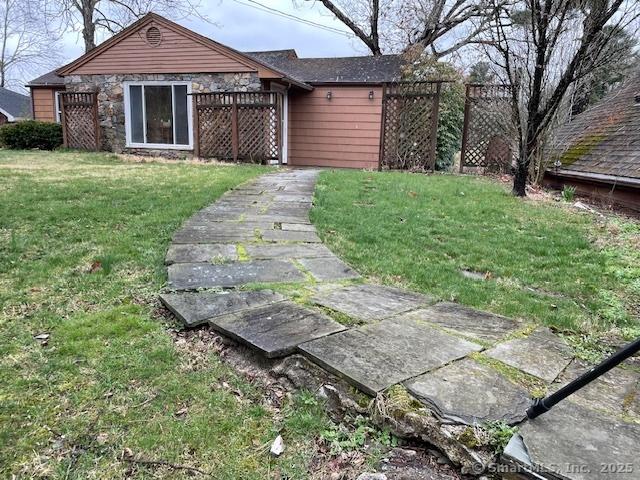 24 Echo Point Rd, Guilford, CT 06437 - view of front of house featuring a front yard and stone siding