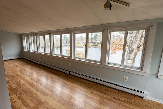 24 Echo Point Rd, Guilford, CT 06437 - unfurnished sunroom featuring a baseboard heating unit, plenty of natural light, and a water view
