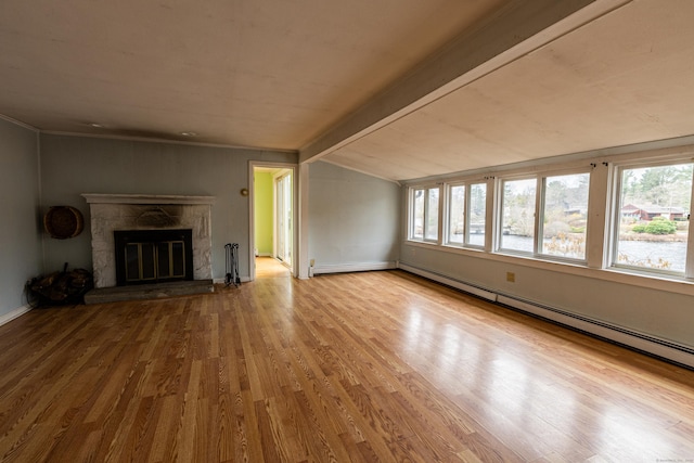 24 Echo Point Rd, Guilford, CT 06437 - unfurnished living room featuring vaulted ceiling, wood finished floors, a baseboard radiator, and a stone fireplace
