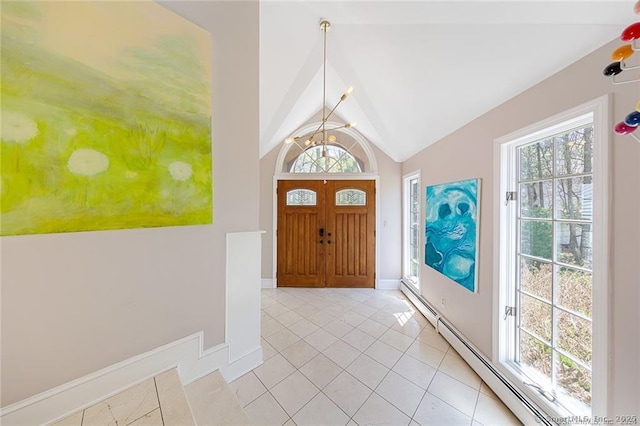 entrance foyer with a chandelier, baseboards, light tile patterned floors, lofted ceiling, and a baseboard heating unit