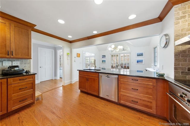 kitchen with stainless steel dishwasher, brown cabinets, wall oven, and a chandelier