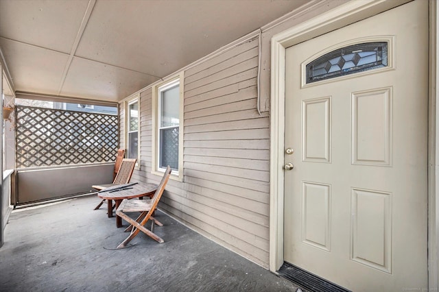 doorway to property featuring covered porch