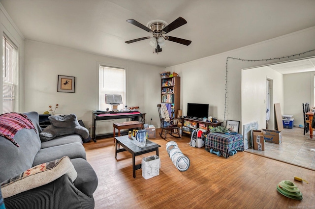 living room with ceiling fan and wood finished floors