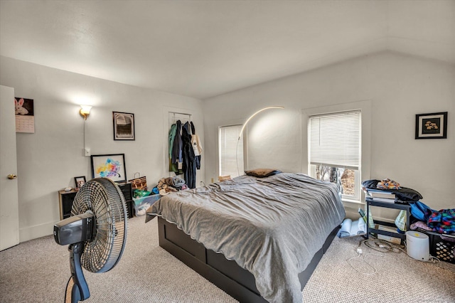 bedroom featuring lofted ceiling and carpet floors