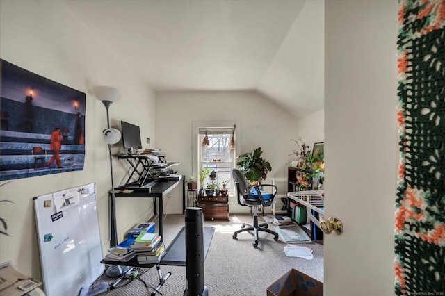 carpeted office featuring lofted ceiling
