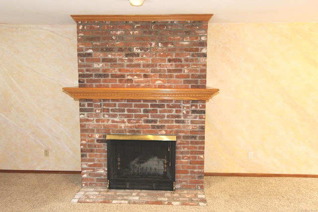112 Paugassett Ln Unit 112, Shelton, CT 06484 - detailed view of carpet floors, a brick fireplace, and baseboards
