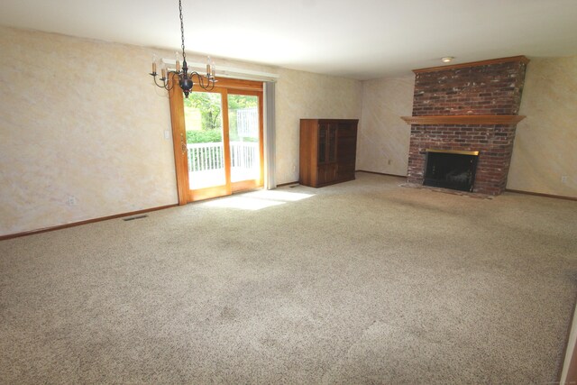 112 Paugassett Ln Unit 112, Shelton, CT 06484 - unfurnished living room with a fireplace, carpet flooring, a chandelier, and baseboards
