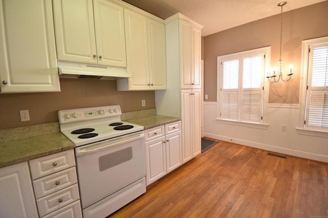 kitchen with light wood-style flooring, a wainscoted wall, white electric stove, white cabinets, and under cabinet range hood