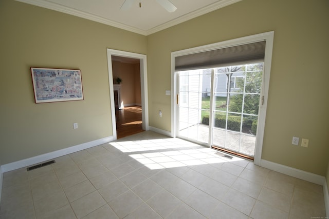 unfurnished room featuring light tile patterned floors, a ceiling fan, ornamental molding, visible vents, and baseboards