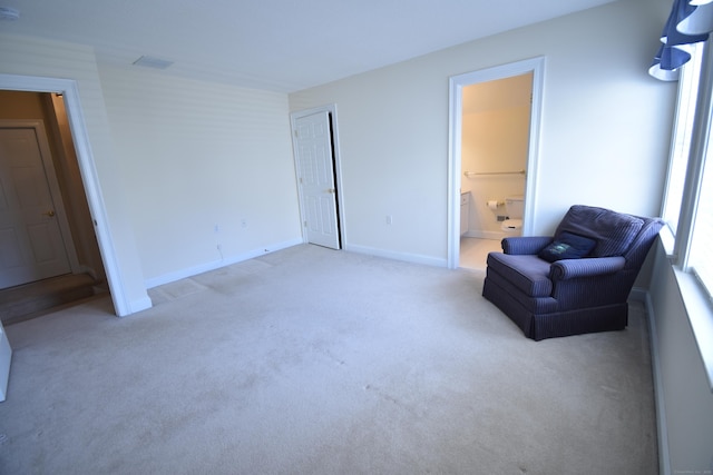 sitting room with carpet and baseboards