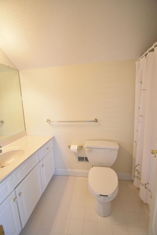 full bath with toilet, vanity, baseboards, and a textured ceiling