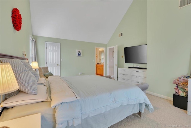 bedroom with high vaulted ceiling, visible vents, light colored carpet, and baseboards