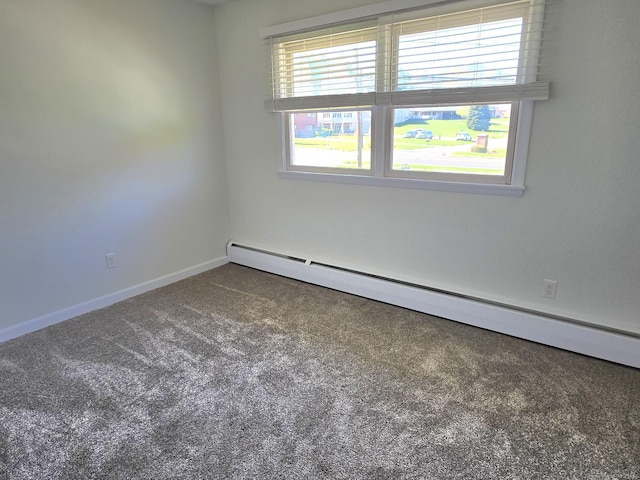 carpeted spare room featuring baseboards and baseboard heating