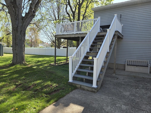 view of yard featuring stairs, fence, and a deck