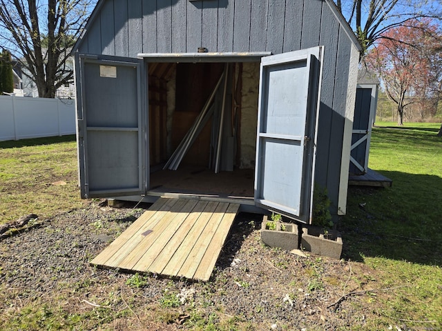 view of shed with fence