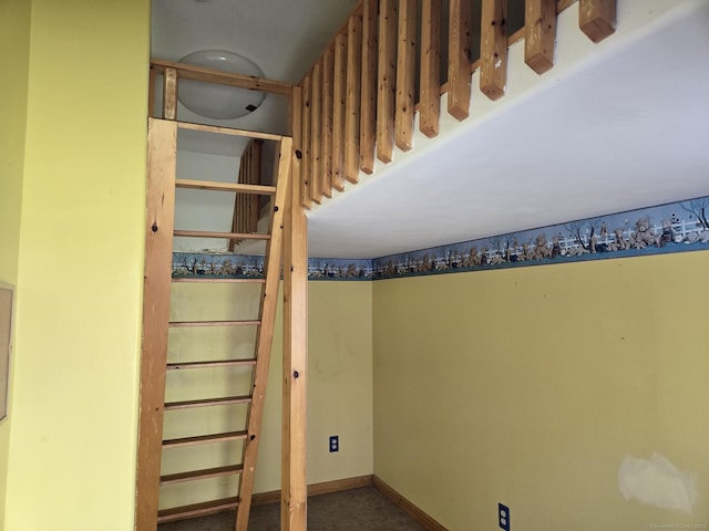 stairway featuring baseboards