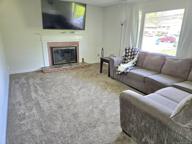 carpeted living room with baseboards and a fireplace