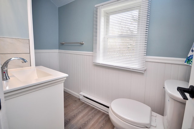 300 Mile Creek Rd, Old Lyme, CT 06371 - bathroom with toilet, a wainscoted wall, a baseboard radiator, vanity, and wood finished floors