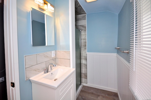 300 Mile Creek Rd, Old Lyme, CT 06371 - bathroom with wood finished floors, a shower stall, vanity, and a wainscoted wall