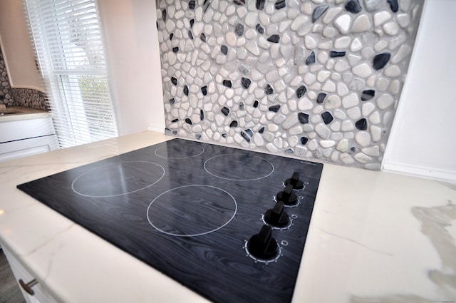300 Mile Creek Rd, Old Lyme, CT 06371 - kitchen view of black electric cooktop and light stone countertops
